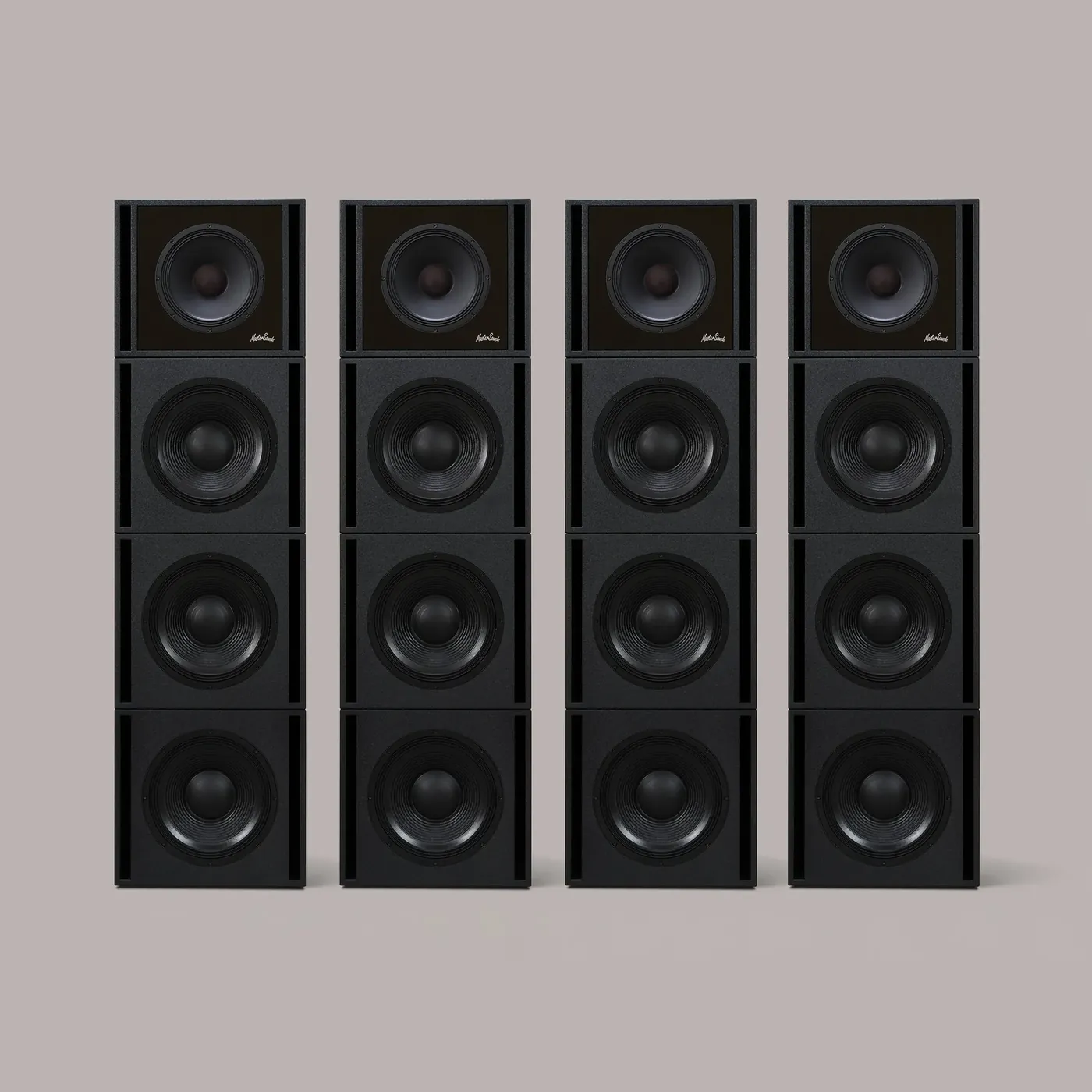 Four tall black Clarity M columns, each four modules high.