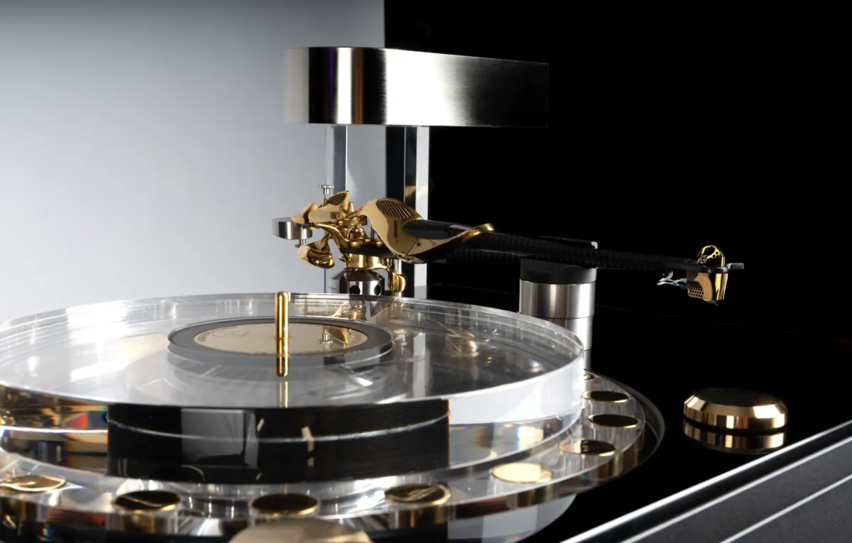 The GMT One turntable with its transparent platter, tonearm and polished metal structures.