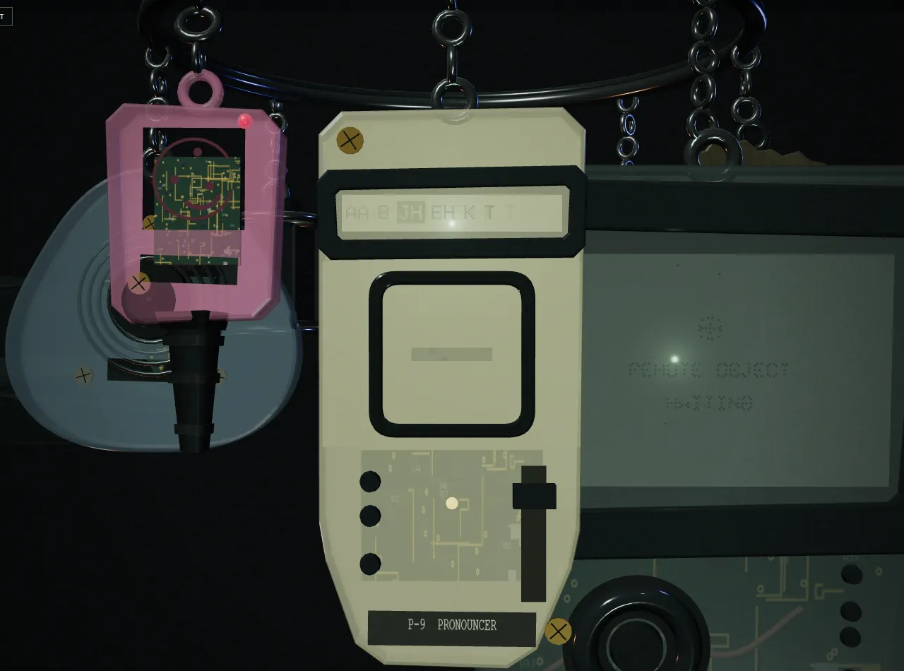 The P-9 Pronouncer, a cream handheld with a slider and three unmarked buttons, its strip showing the phonemes it is saying, between a pink key and the RO-404.